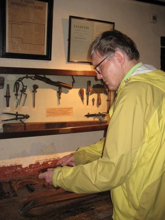 Gordon in Louis Braille's workshop inspecting his tools. 